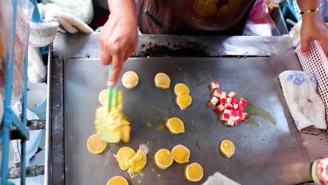 cooking crab stick pancakes on a hot griddle