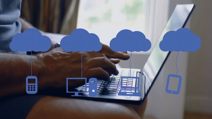 Animation of media icons over caucasian man using laptop