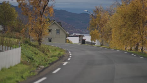 a narrow road goes through the coastal village