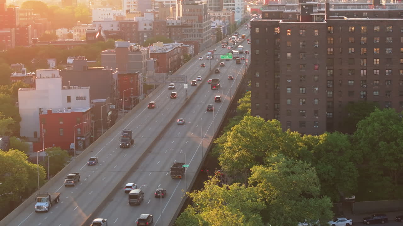 Aerial view of the Brooklyn Queens Expressway at sunrise. Shot in New York City during the morning rush hour.