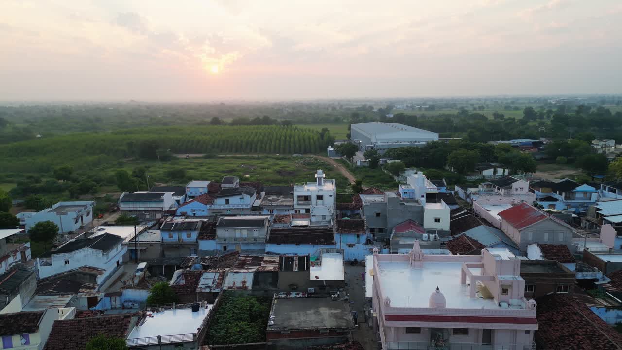 Early Morning drone shot of a small Village, old and new houses, Drone flying back, Gujrat village, rural development