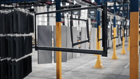 metal frame hanging on chains in factory