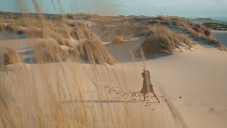 girl performing dance dunes at summer evening. woman dancer moving sensually.