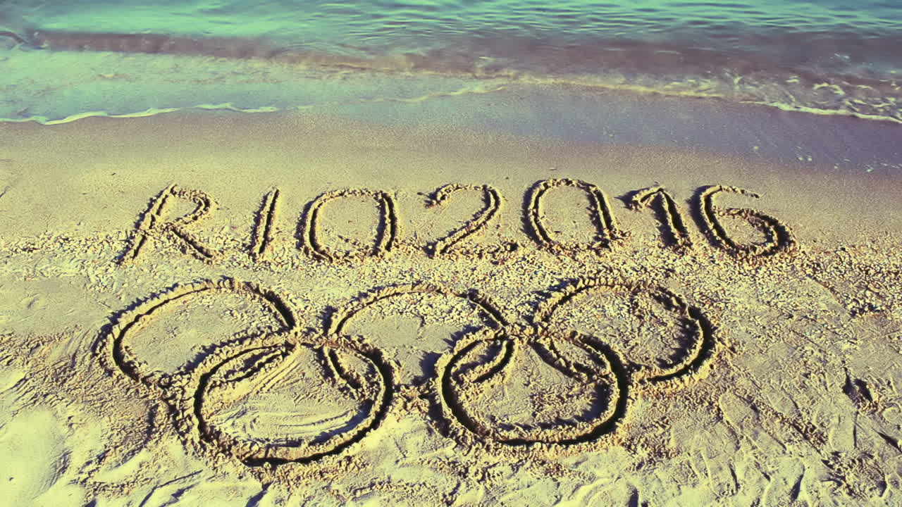 Rio 2016 an inscription on sand, the beach. Symbol Olympic game on sand, the beach