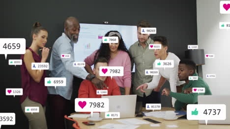 social media notifications animation over diverse business team collaborating in office