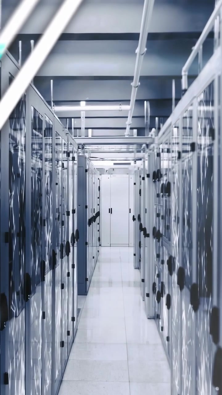 Vertical video: Center aisle showing overlays appearing, visualizing metrics on data racks