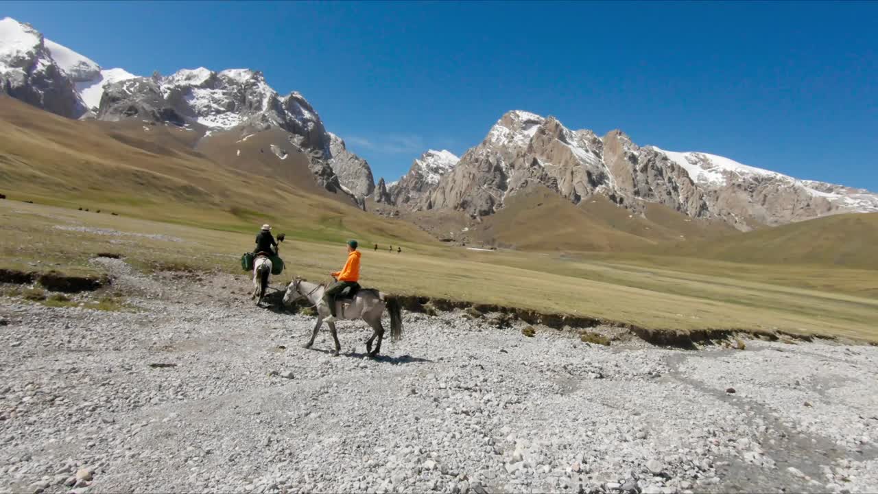 Incredible Beautiful Horse riding in Kyrgyzstan. Incredible landscapes. Mountains alpines lakes and rivers. Amazing view 02