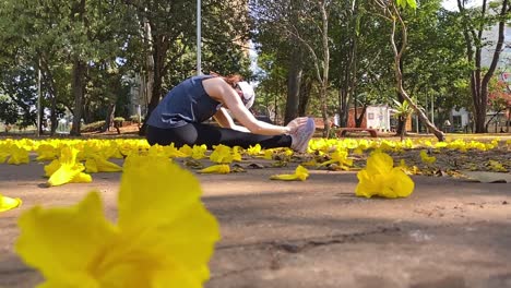 woman stretching her arms at the city park