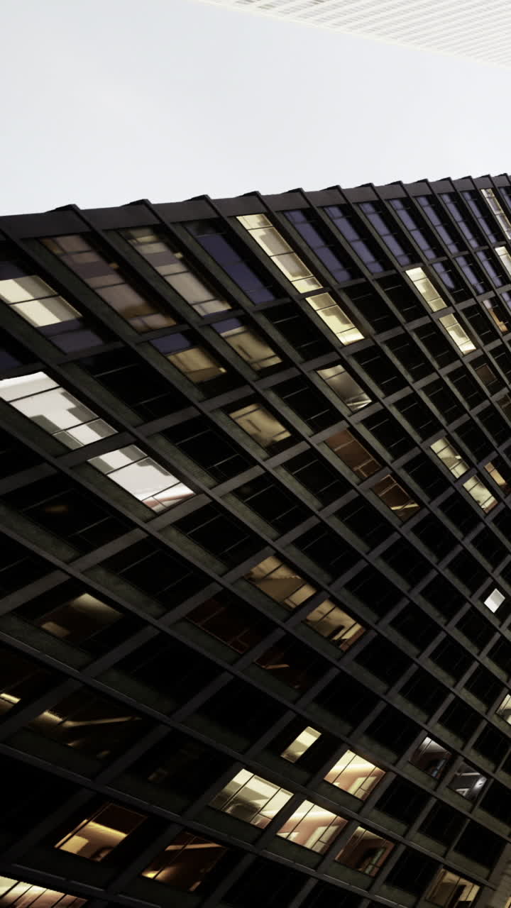 Unique architectural design with angled glass panels reflecting sunlight