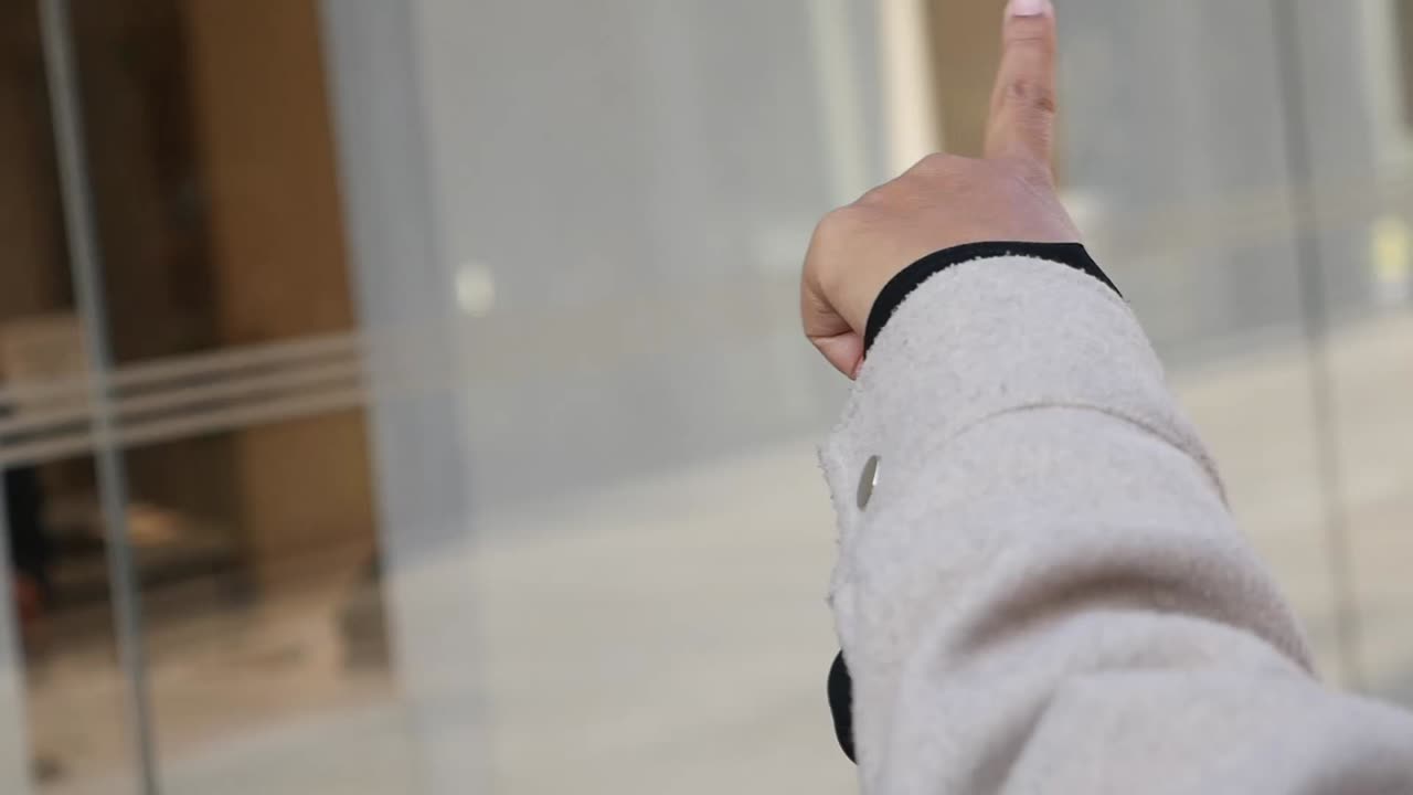 Arm Pointing Upwards with Blurred Background