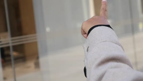 arm pointing upwards with blurred background