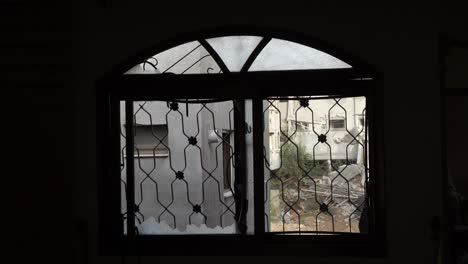 iron barred windows of a house in the gaza strip, palestine