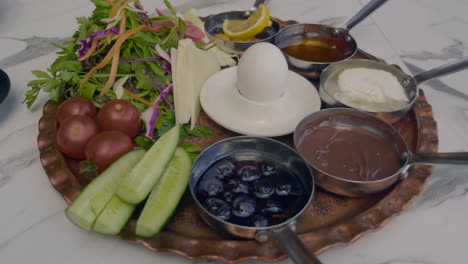 delicious and healthy breakfast spread with fresh vegetables, fruits, and various dishes