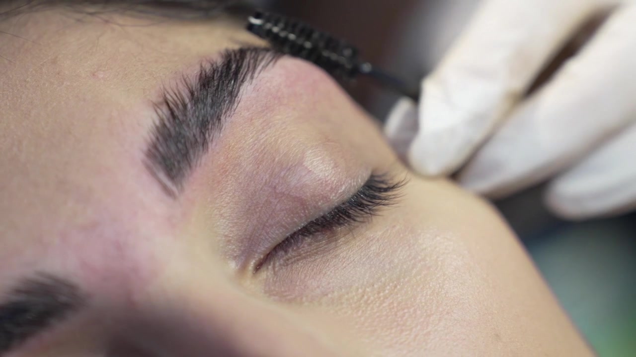 Eyebrow Closeup: Professional Shaping and Correction with Tweezers after Wax