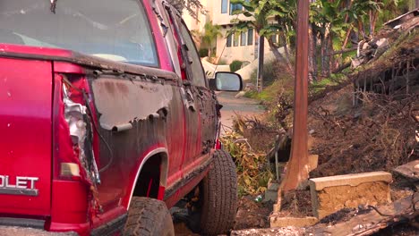 The-side-of-a-pickup-truck-is-scorched-and-melted-by-intense-heat-from-hillside-fire-following-the-2017-Thomas-fire-in-Ventura-County-California-1