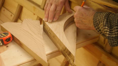 skilled boatbuilder templating oak seat knee