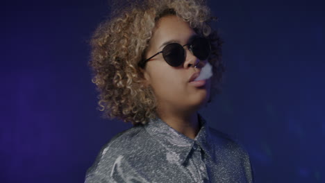 stylish woman smoking at a nightclub