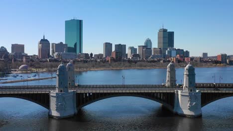 aerial establishing city skyline of boston massachusetts with longfellow bridge and subway train crossing 2