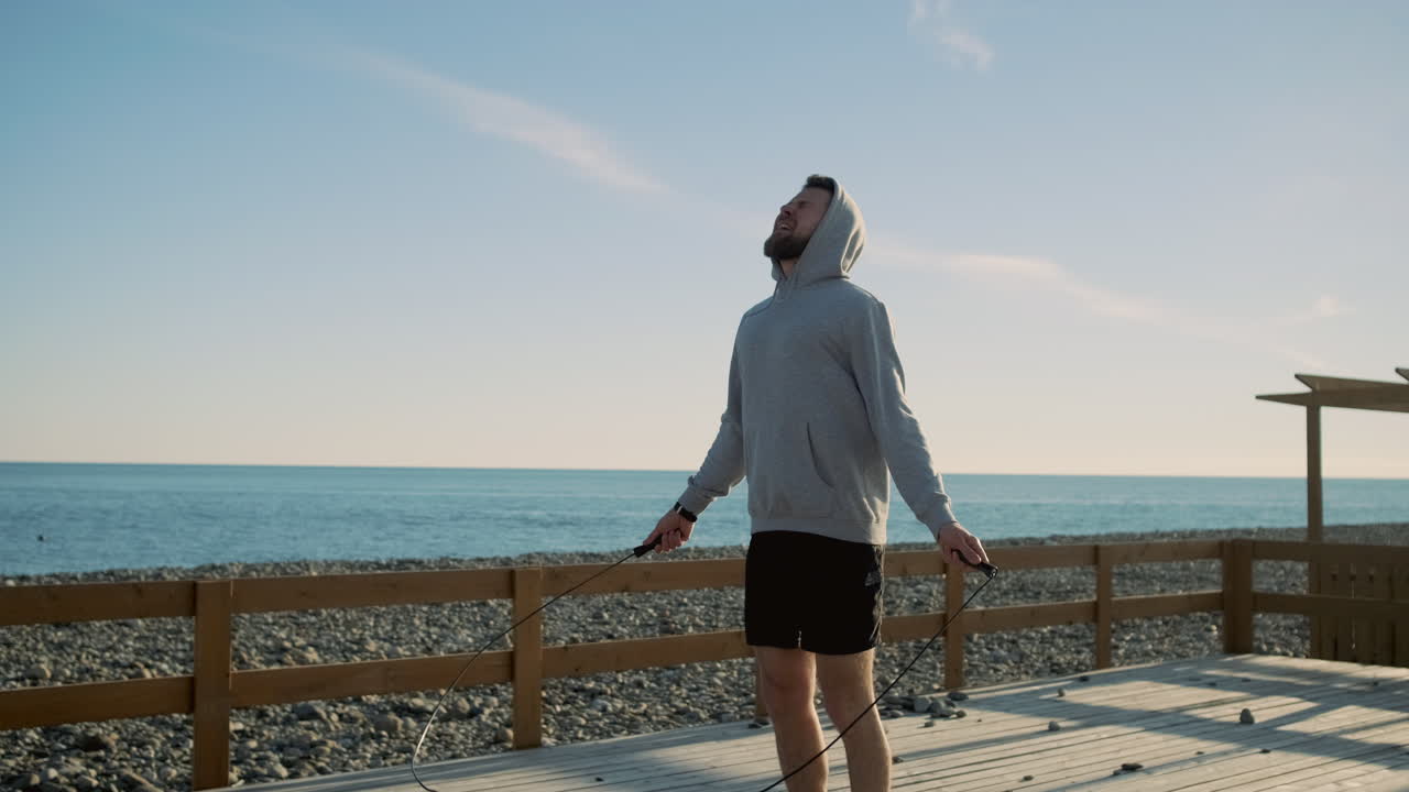 Man Skipping Rope at Beach Pier