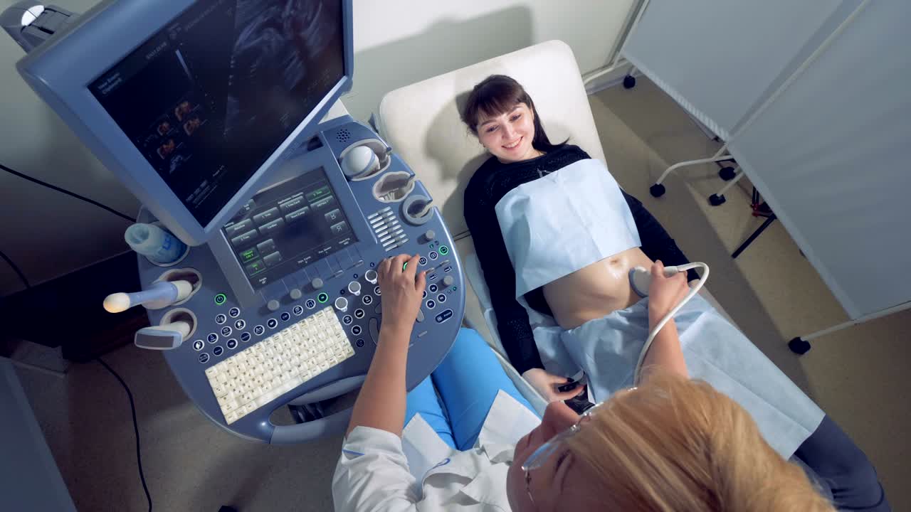 Top view of a pregnant lady during ultrasound procedure
