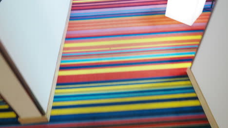 colorful striped carpet in a hallway