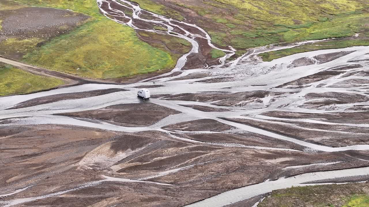 White Van Crossing In The River With Braided Channel In Nyjidalur, Iceland. - aerial shot