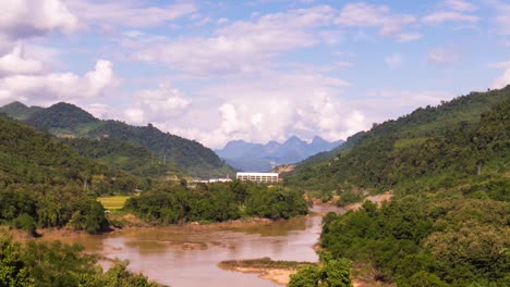 hydro power dam in a valley on a mekong subsidiary in north laos