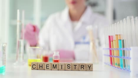 chemistry experiment in a lab with scientist and equipment