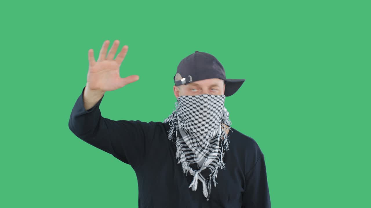 Aggressive protester raising hand during riot or political protest