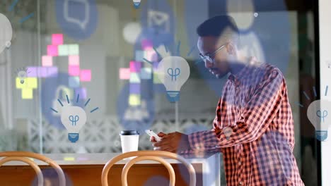 animación de iconos digitales sobre el hombre usando un teléfono inteligente