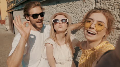 friends posing for selfie