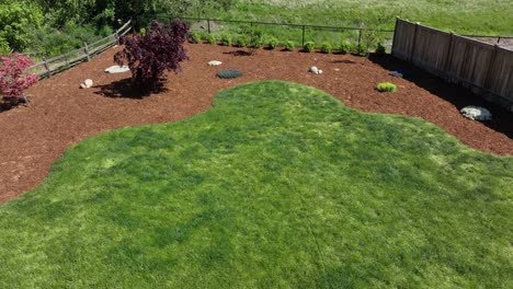 drone shot of private backyard space with a lush green lawn