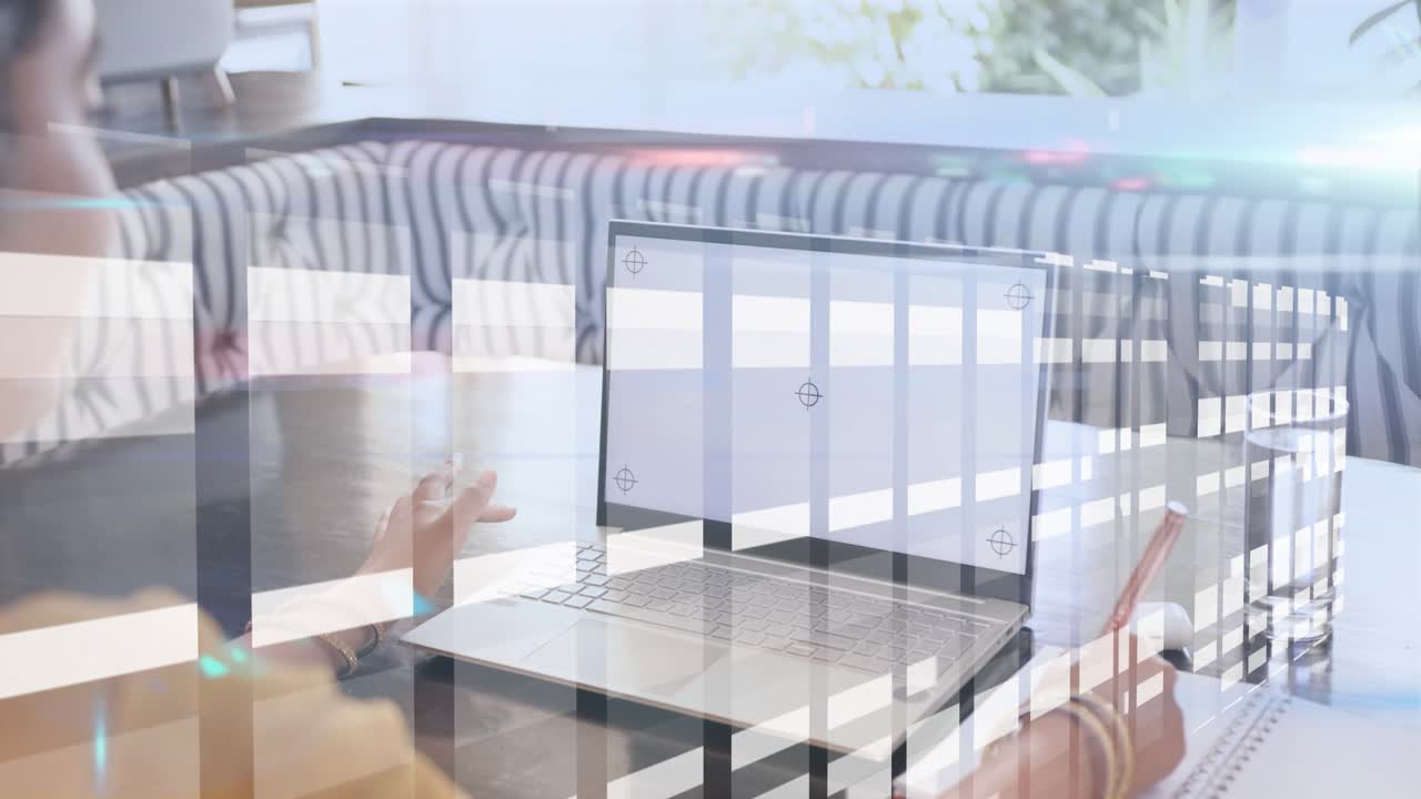 Woman reaching trackpad and pointing laptop while taking tech notes as grid passing over subject