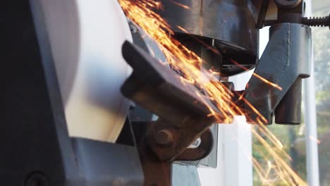 Slow-motion-video-footage-of-sparks-generated-by-grinding-a-knife-on-a-sharpening-stone