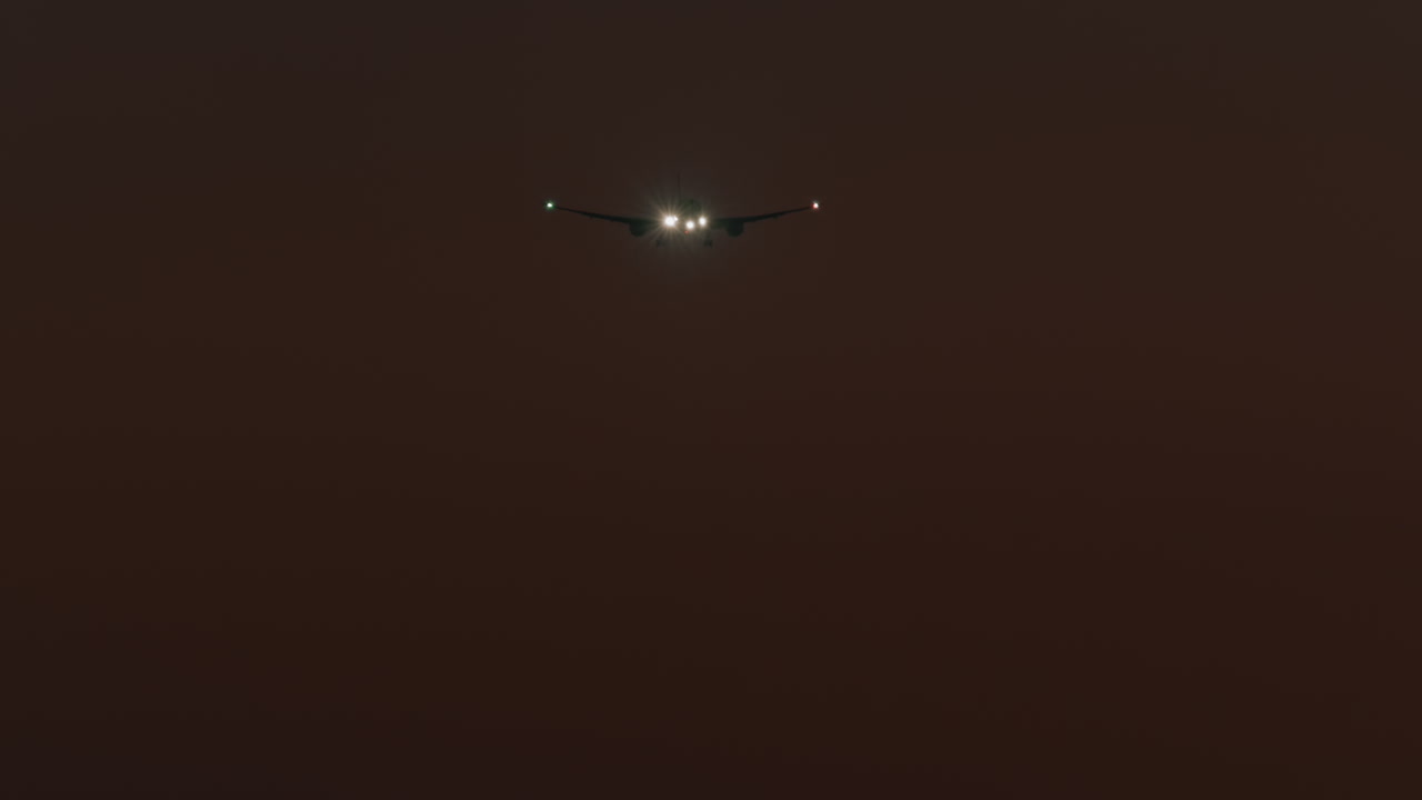 The plane lands at night