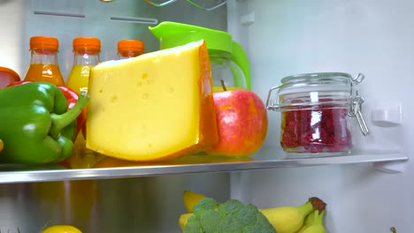 Open-refrigerator-filled-with-food