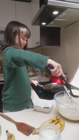 girl cooking pancakes