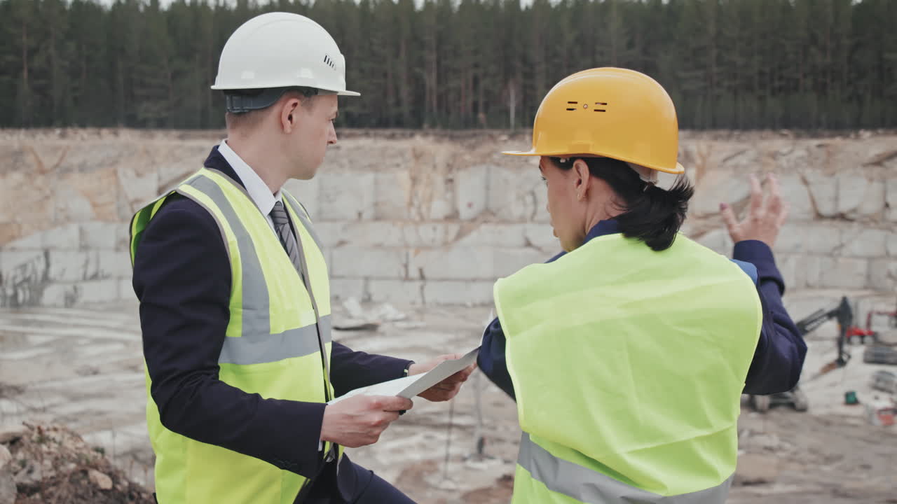 Quarry Supervisor and Manager Having Conversation