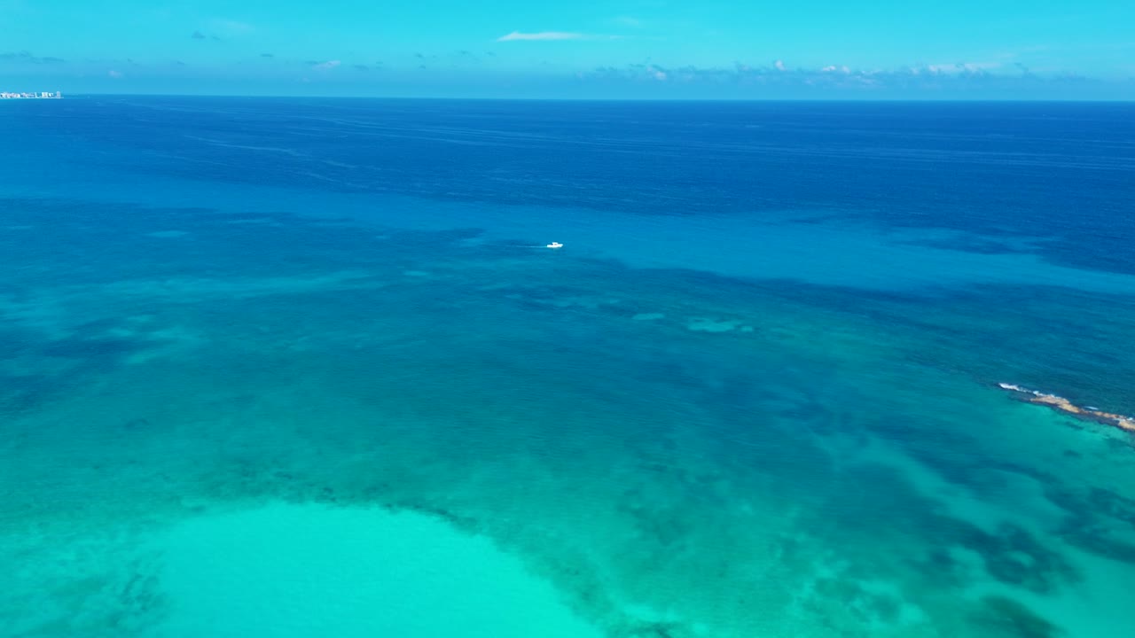 Drone aerial landscape of fishing trawler boat docked in reef sandbar ocean of Cancun Caribbean Sea Mexico snorkelling tours activities travel holidays tourism