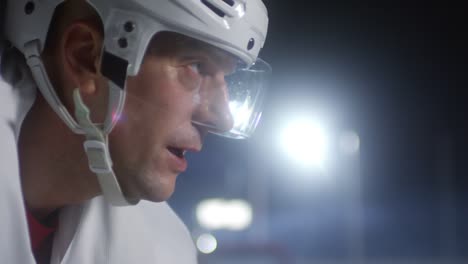 concentrated ice hockey player breathing and looking in front of him