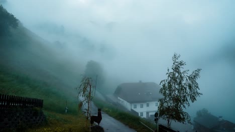 Foggy-morning-time-lapse-in-a-small-European-mountain-village-in-South-Tyrol,-Dolomites,-Italy