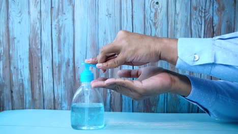 washing hands with hand sanitizer