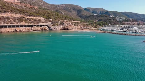 Skatesurfing-along-coast-of-Port-Ginesta-in-Spain