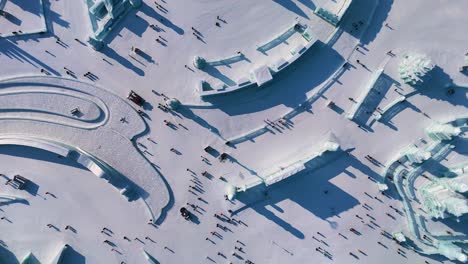 top-down drone shot of harbin ice festival sculptures and ice block with snow in harbin, heilongjiang, china