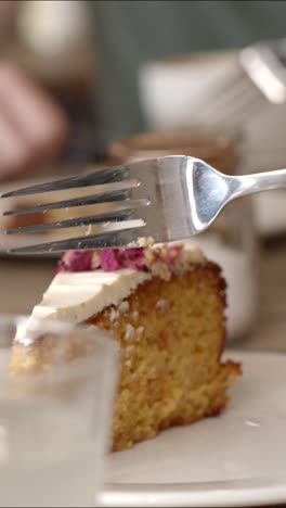 slicing cake with a fork