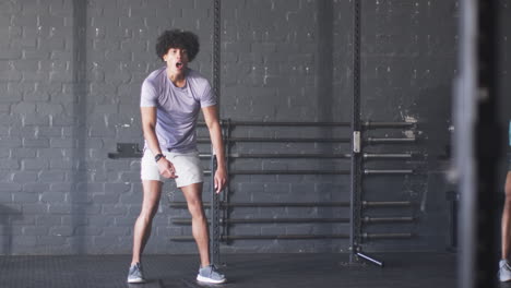 exercising in gym, man in athletic wear taking break from workout, copy space