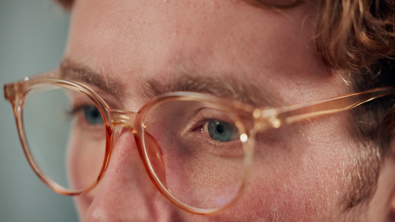 Close-up of a man's face with glasses