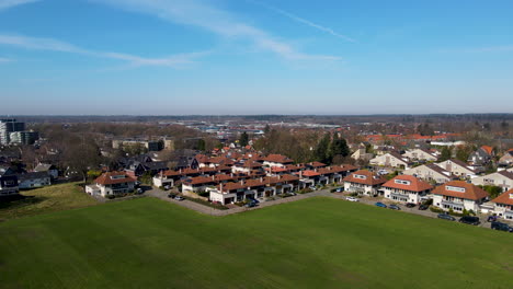 Aerial-of-suburban-neighborhood-at-the-edge-of-meadow