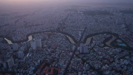 aerial view of ho chi minh city urban sprawl and canals in late sunny afternoon light