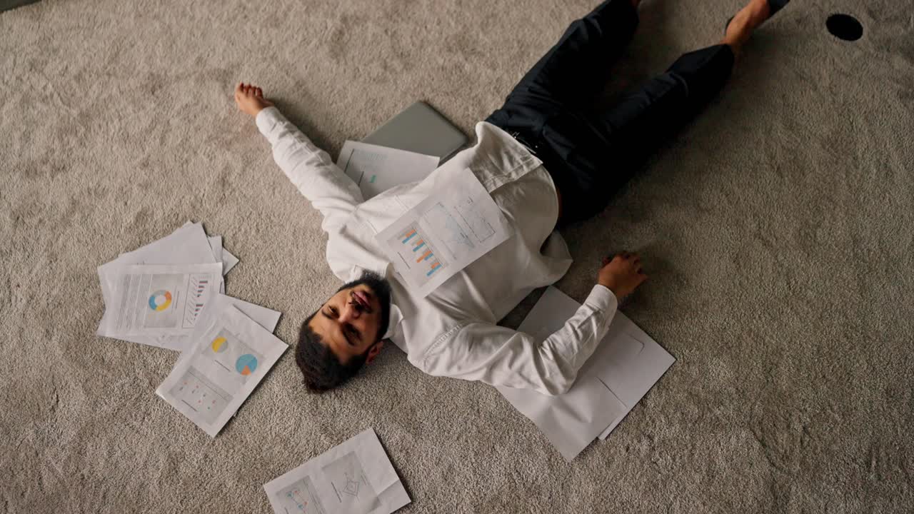 Overworked Businessman Sleeping on the Floor
